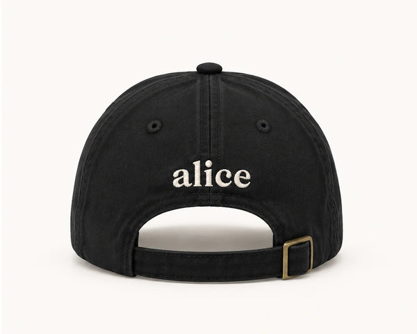 back of black alice dad hat with embroidered alice logo and brass buckle