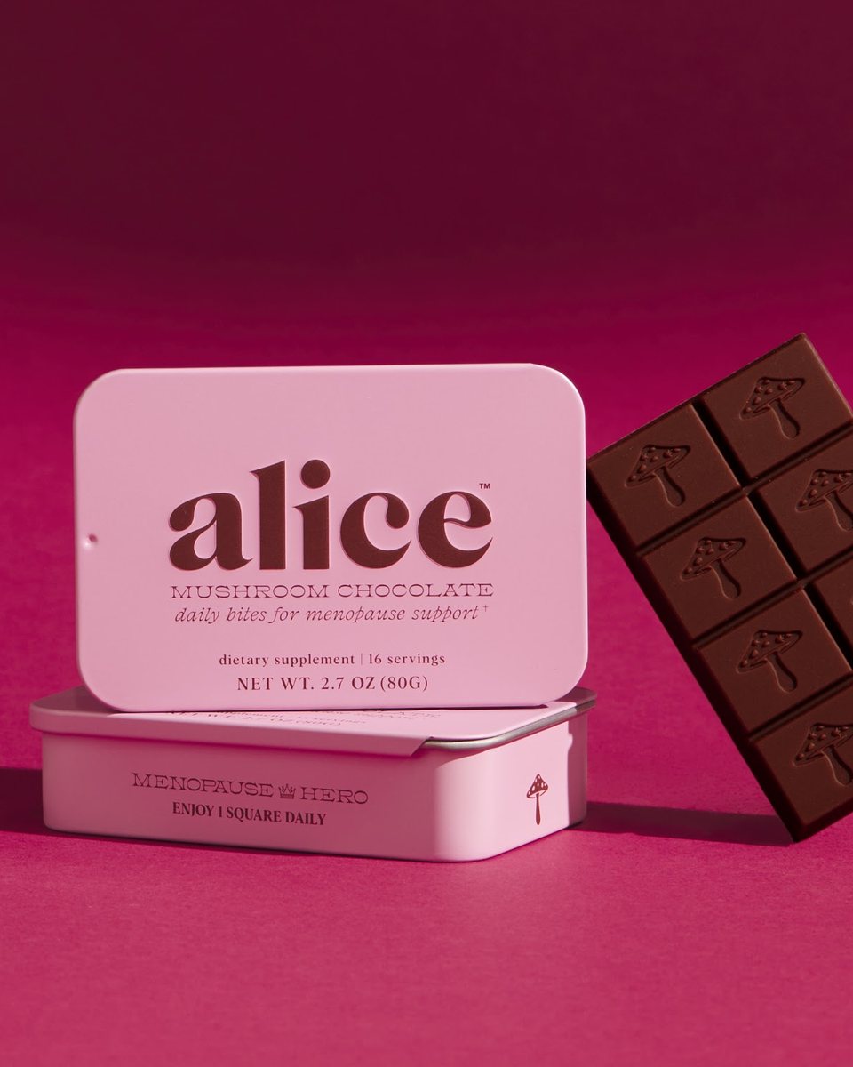 Two pink Menopause Hero tins beside a bar of alice dark chocolate on a magenta backdrop