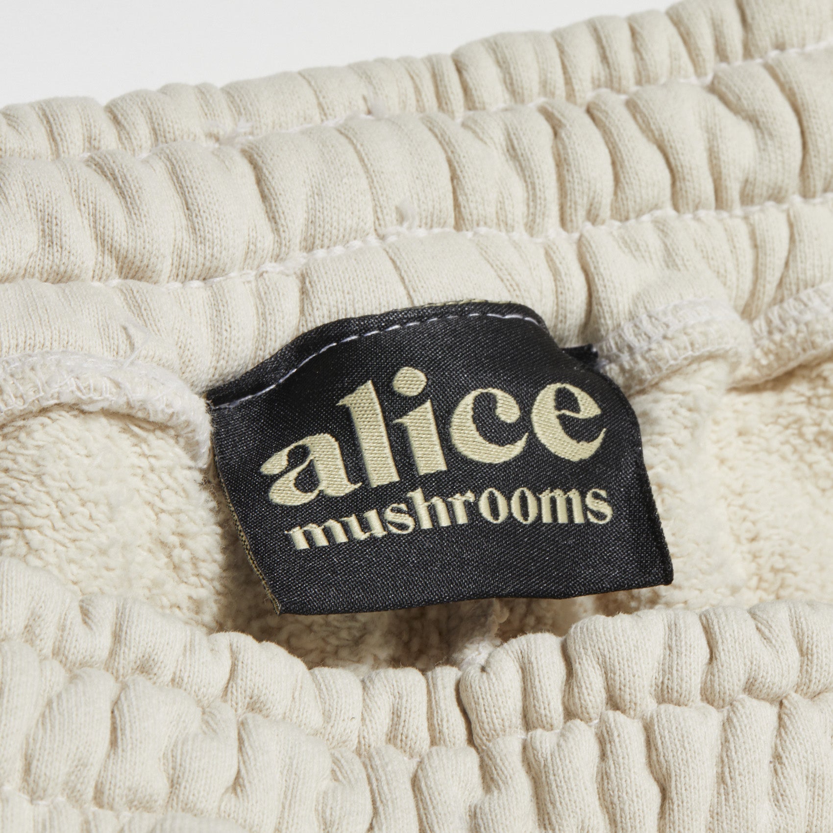 mushroom sweats - cream logo